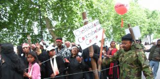 Tamils marching in London enact the horrors facing those interned in the Chettikulam concentration camp by the Sri Lankan army