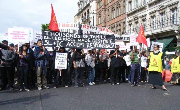 Demonstrators in London in June last year condemn the slaughter of thousands of Tamils by the Sri Lankan army