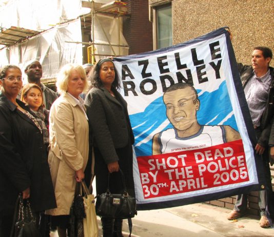 SUSAN ALEXANDER, mother of Azelle Rodney,  (centre, holding banner) and supporters outside yesterday’s hearing