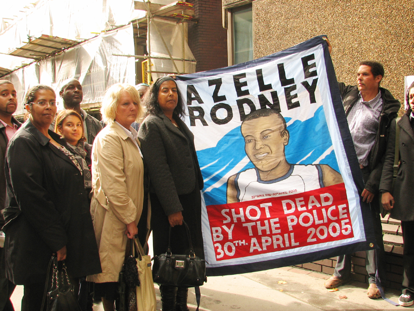 SUSAN ALEXANDER, mother of Azelle Rodney,  (centre, holding banner) and supporters outside yesterday’s hearing