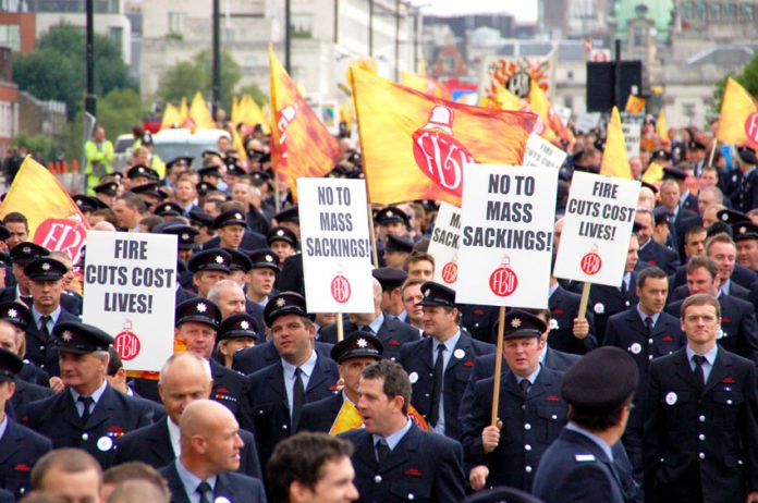 Firefighters marching in London last month against the threat of mass sackings