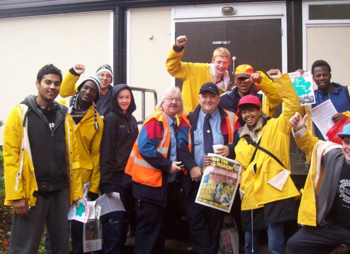 A group of marchers with supporters, busworkers PHIL PEAK and RODNEY GARNER who said ‘The way that these young people are standing up for their rights is brilliant’