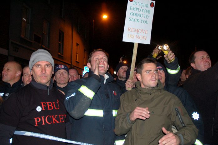 Striking London firefighters demonstrated on Monday night outside the Southwark fire station where a number of attacks were made on them