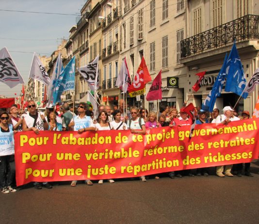 French workers marching in Marseilles demand the government abandon their policiy to increase the pensionable age
