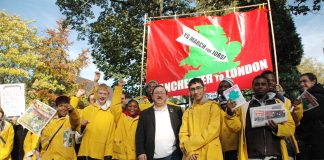 Marchers with busworkers Unite union official John Hughes just before the march began on October 30 in Manchester