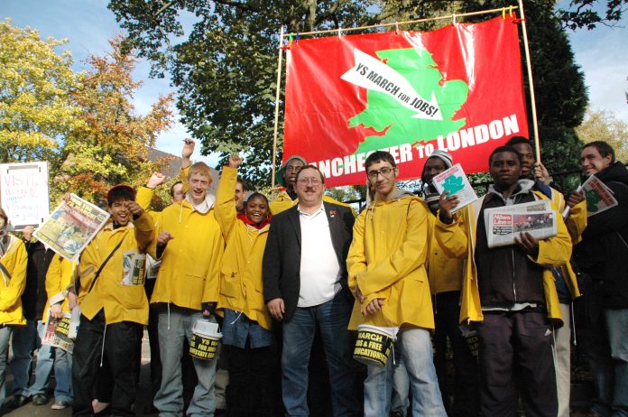 Marchers with busworkers Unite union official John Hughes just before the march began on October 30 in Manchester