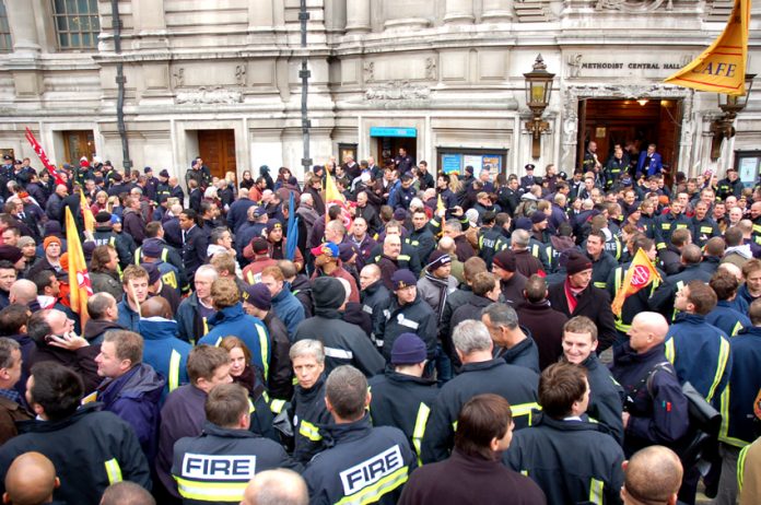 Firefighters gather outside the Central Hall, Westminster after their rally to begin lobbying their MPs