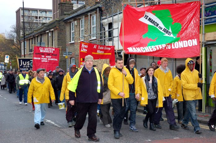 Young Socialist marchers lead the way to yesterday’s News Line Anniversary rally in the final mile of their journey from Manchester to London