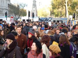 Students in high spirits as police vans cordon them in