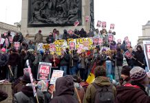 Students gathered in their thousands in Trafalgar Square at midday yesterday and many took up their positions on Nelson’s Column