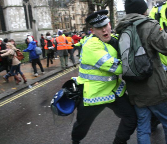 Police attack youth trying to march to Parliament to protest about the plan to raise tuition fees to £9,000 a year – Photo by Gareth Jukes