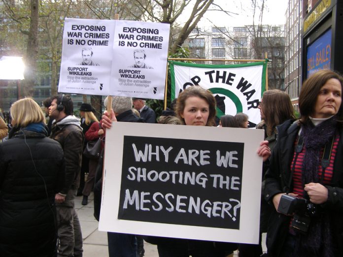 Basic rights were under attack on all fronts yesterday. Picture above shows demonstration in support of the jailed WikiLeaks founder Julian Assange outside Westminster Magistrates Court where he was bailed but not immediately freed