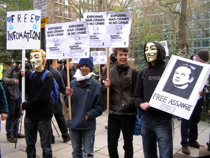 Young demonstrators showing their support for the WikilLeaks founder