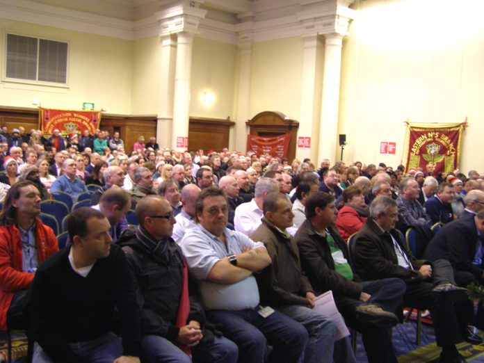 Over 1,000 postal workers rallied at the Central Hall in Westminster yesterday mid-day to fight the plan to privatise Royal Mail which threatens 30,000 jobs