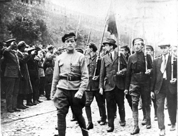 TROTSKY (far left) reviews a Red Square march of workers and soldiers. They were clear that their revolution was the start of the struggle to smash capitalism and imperialism worldwide