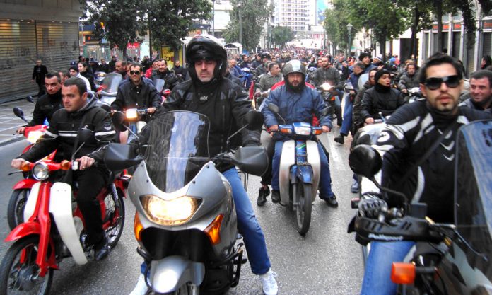 Greek transport workers demonstration led by a cavalcade of 200 motorcyclists in Athens