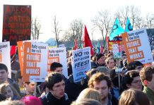 Students and workers rally in Manchester against tuition fees and cuts – a placard reads: ‘’Aaron Porter doesn’t represent me’