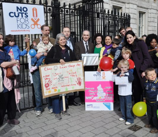 Sure Start Children’s Centre campaigners and children outside Downing Street with the over 50,000-strong petition opposing the centres closures