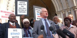The four Kenyan claimants with lawyer Martin Day outside the High Court before the start of yesterday’s hearing