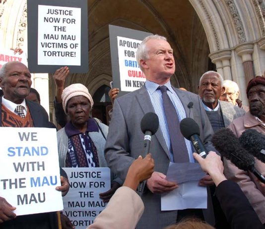The four Kenyan claimants with lawyer Martin Day outside the High Court before the start of yesterday’s hearing