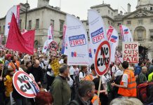 Members of the Royal College of Nursing with their banners demonstrating against mass sackings of NHS staff on March 26