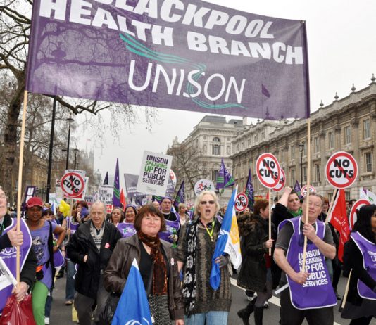 The Blackpool Health branch of Unison marching against job cuts on the TUC demonstration on March 26