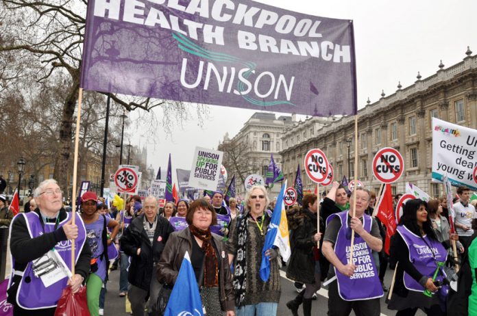 The Blackpool Health branch of Unison marching against job cuts on the TUC demonstration on March 26