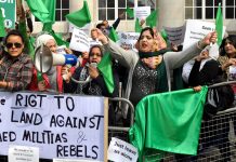 Libyan women, proclaiming their right to defend their country against armed rebels, picketing the recent Contact Group meeting in London