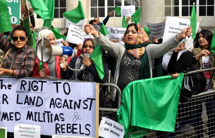 Libyan women, proclaiming their right to defend their country against armed rebels, picketing the recent Contact Group meeting in London