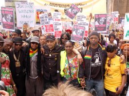 The family and friends of Smiley Culture lead a march of thousands of people to New Scotland Yard on Saturday. Others whose loved ones have died in police custody also joined the march