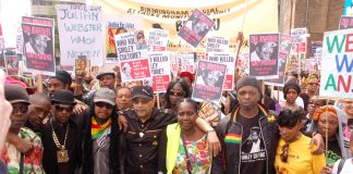 The family and friends of Smiley Culture lead a march of thousands of people to New Scotland Yard on Saturday. Others whose loved ones have died in police custody also joined the march