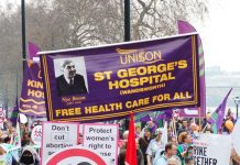 Trade union banners and placards demanding defence of the NHS and no cuts – these will be key demands on May Day