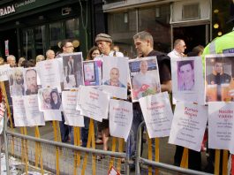 New Aid Flotilla To Set Sail For Gaza! Demonstration in support of the attacked Freedom Flotilla, displaying pictures and details of those who died