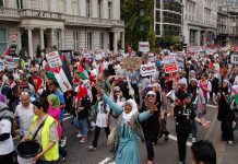 London demonstrators voice their support for the Palestinian people after the massacre of international aid acitivists at the hands of Israeli commandos as they tried to sail to the besieged Gaza Strip a year ago with food, medicines and other vital suppl