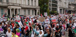 London demonstrators voice their support for the Palestinian people after the massacre of international aid acitivists at the hands of Israeli commandos as they tried to sail to the besieged Gaza Strip a year ago with food, medicines and other vital suppl