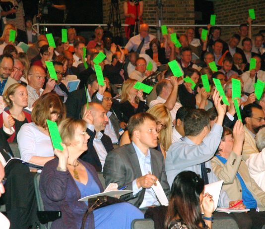 Doctors voting at yesterday’s GPs conference where they rejected the government’s NHS privatisation plans