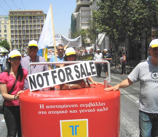 Greek postal workers march through Athens with a clear message in English: the postal service is ‘not for sale’!