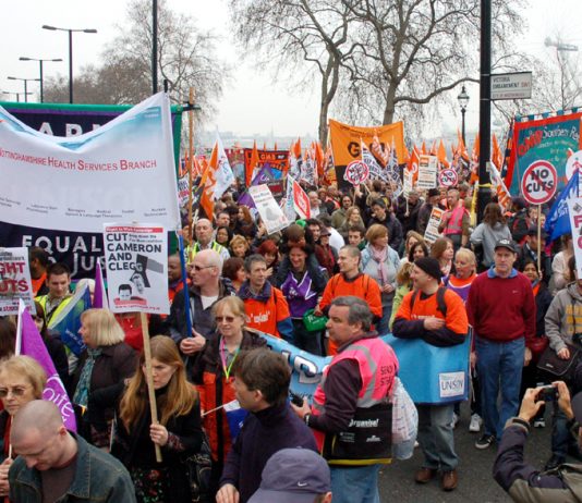 Union banners from Unite and the GMB on the 500,000-strong TUC demonstration against cuts on March 26