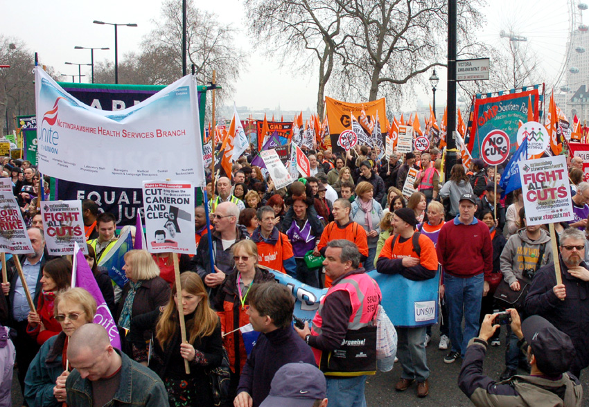 Union banners from Unite and the GMB on the 500,000-strong TUC demonstration against cuts on March 26