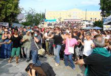 Victorious dancing in the square in front of the Vouli as the Papandreou government falls