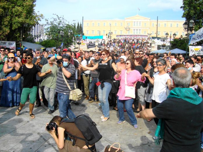 Victorious dancing in the square in front of the Vouli as the Papandreou government falls