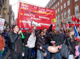 The News Line-All Trades Union Alliance banner on the March 26th 500,000-strong TUC demonstration against cuts