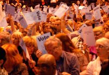 Unison conference delegates voting to oppose the coalition’s attacks on health, education and pensions