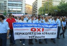 Greek police marching against the cuts in Vouli square, opposite the parliament building