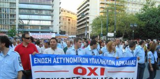 Greek police marching against the cuts in Vouli square, opposite the parliament building