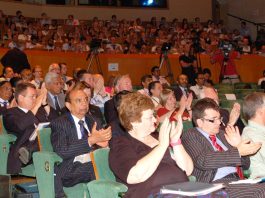 Delegates applaud at the BMA’s ARM on Monday as doctors condemned cuts to the NHS