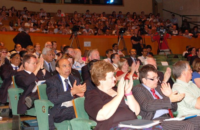 Delegates applaud at the BMA’s ARM on Monday as doctors condemned cuts to the NHS