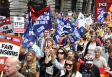 A very enthusiastic delegation, complete with whistles and banners, making their way to Westminster as part of the march