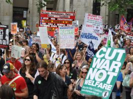 Workers Demand A General Strike To Defend Their Pensions The banner of the Workers Revolutionary Party and Young Socialists among the crowds on Thursday’s march