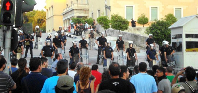 Outside the Vouli on Thursday evening – young workers stand their ground against the riot police